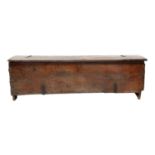A Late 16th Century Boarded Oak Chest, of six plank construction, the hinged lid with moulded edge