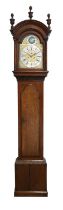 An Oak Eight Day Longcase Clock, arch pediment, arch crossbanded trunk door, carved borders, 12-inch