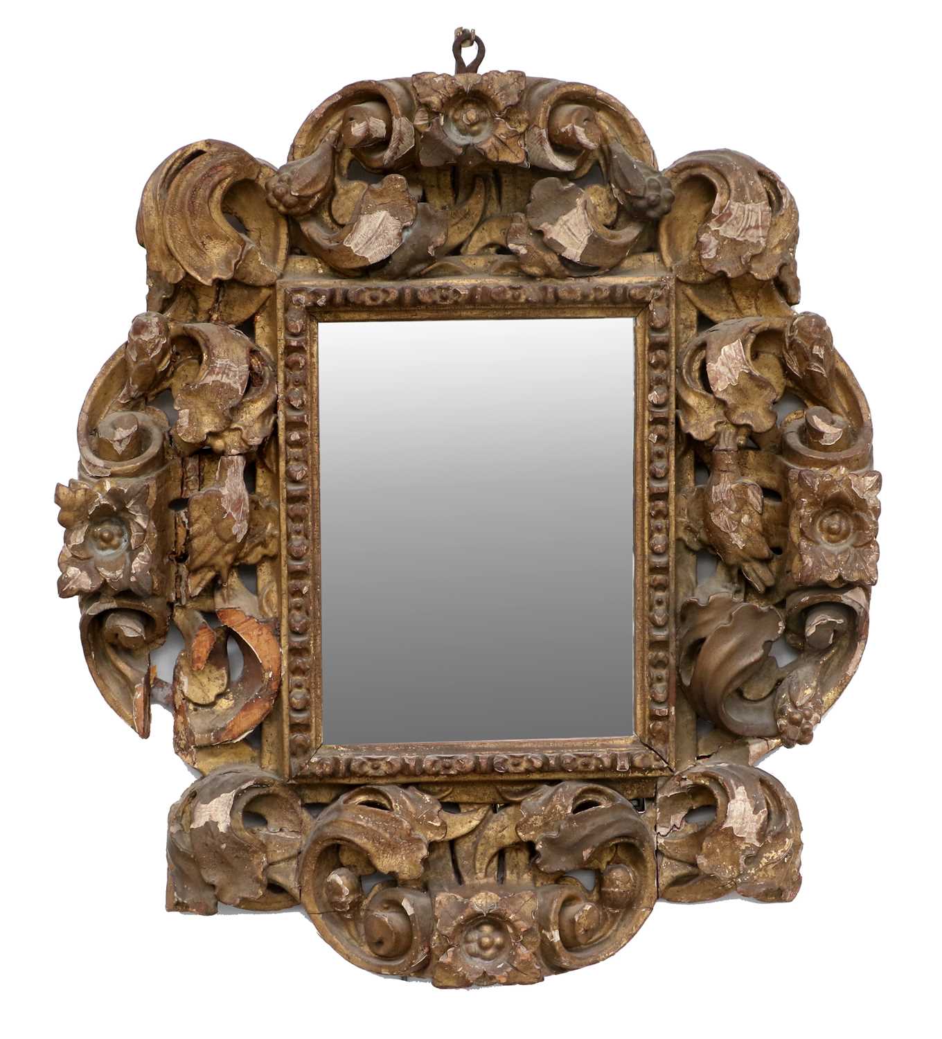 An 18th Century Italian Carved Giltwood Frame, the later plain mirror plate within acanthus leaf and