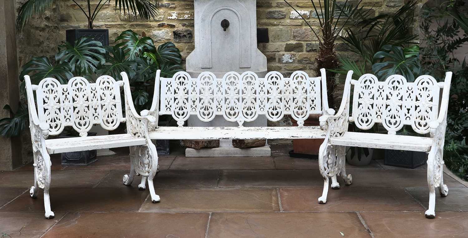 A Victorian Cast Iron and Later Painted Three Piece Garden Set, late 19th century, the foliate