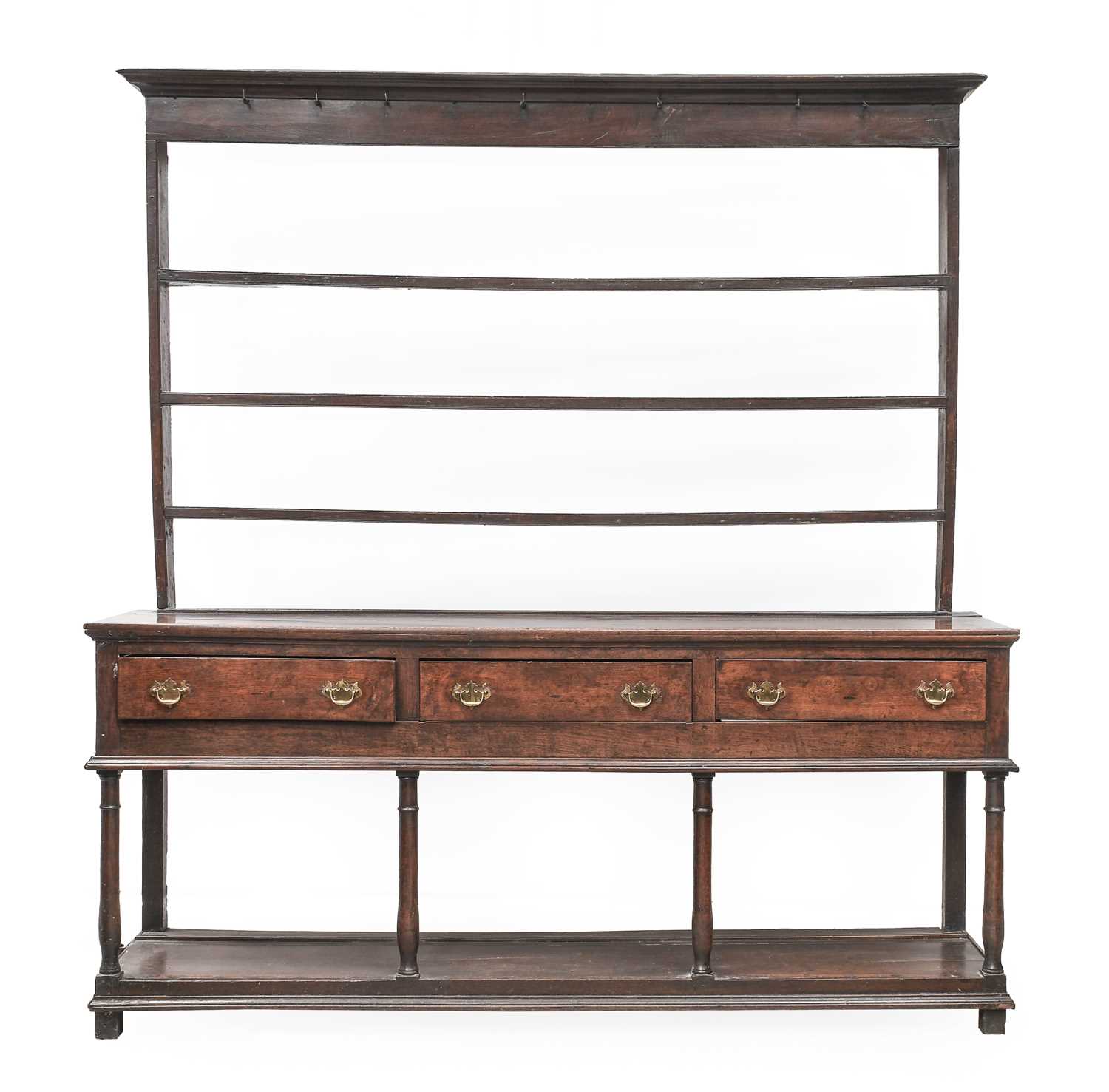 A George III Oak Dresser and Rack, 3rd quarter 18th century, the moulded cornice above iron cup