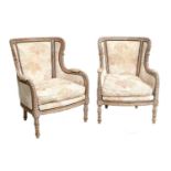 A Pair of 20th Century Upholstered Close-Nailed Armchairs, with limed wood show frames, covered in