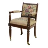 A William IV Carved Mahogany Open Armchair, 2nd quarter 19th century, covered in floral