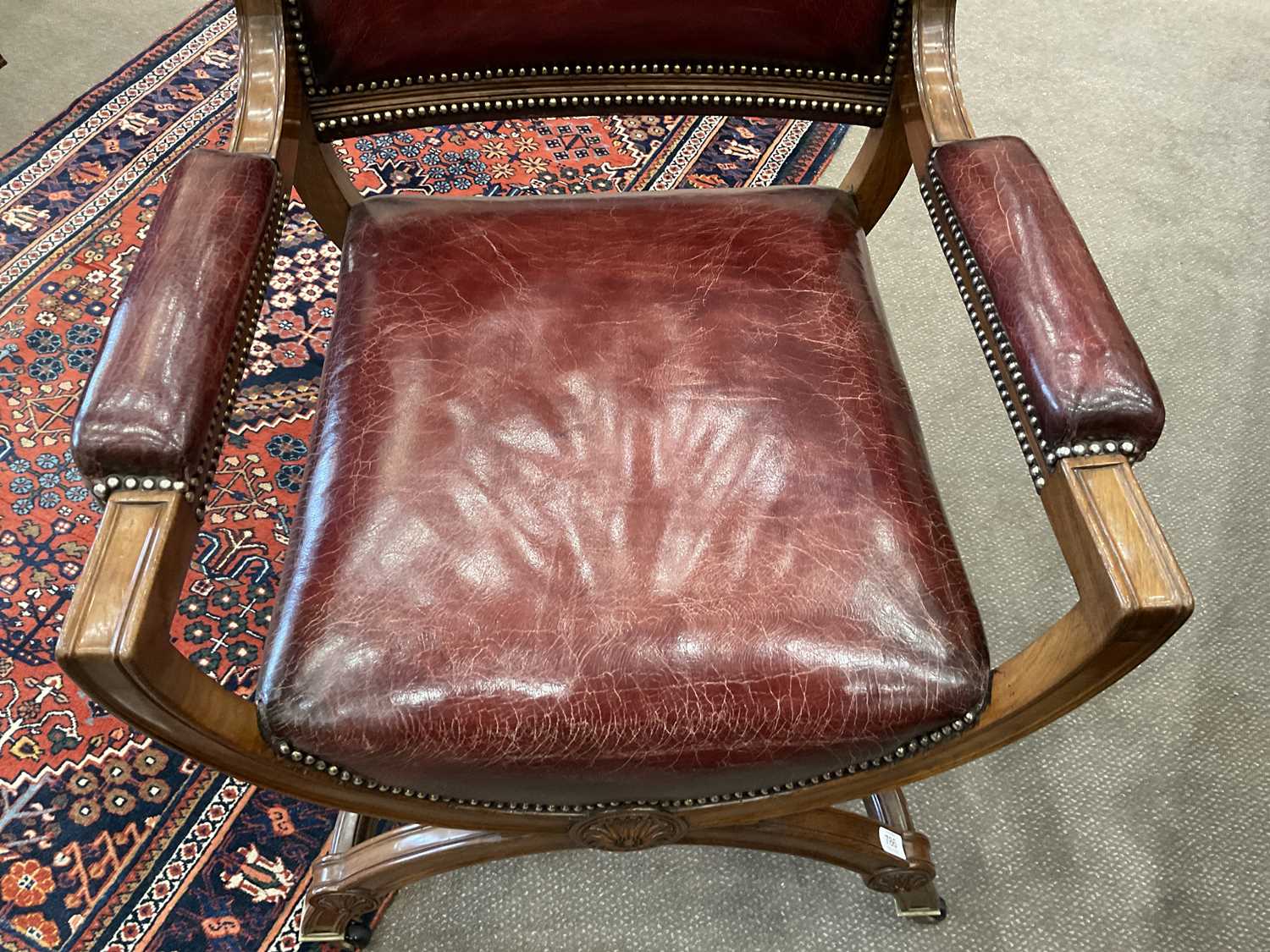 A Victorian Walnut X-Form Chair, late 19th century, recovered in red close-nailed leather, the - Image 3 of 5