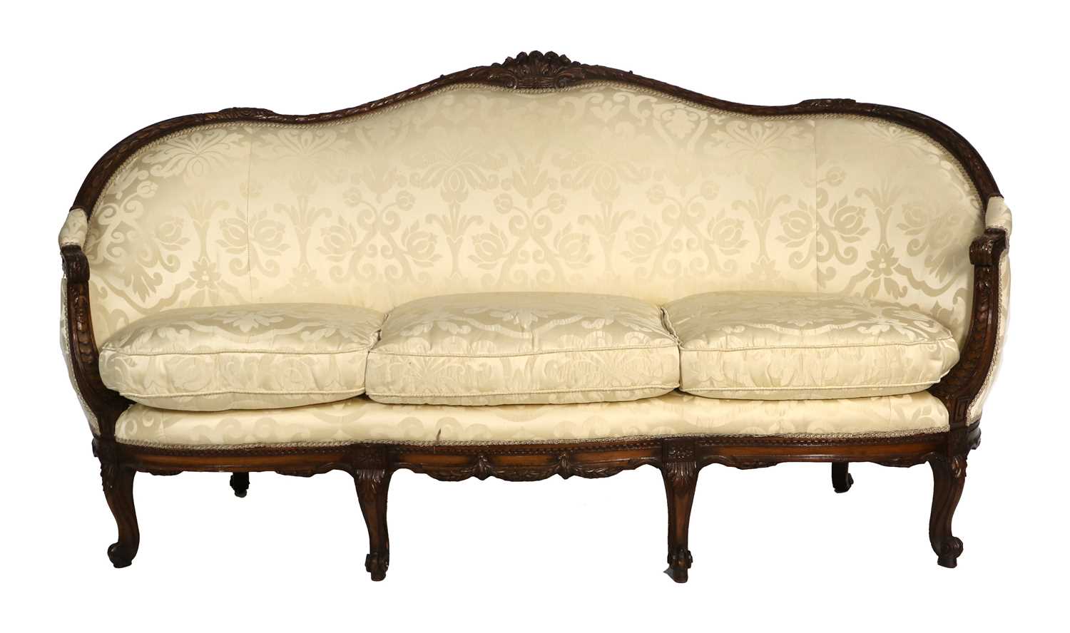 A Late 19th Century Carved Walnut or Beech Three-Seater Sofa, covered in yellow silk damask, the