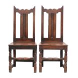 A Pair of Joined Oak Back Stool, circa 1720, the wavy-shaped top rails above moulded splats and
