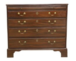 A George III Mahogany and Oak-Lined Bachelor's Chest, circa 1800, the moulded top above a pull-out