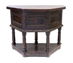 A Late 17th Century Joined and Carved Oak Credence Table, the hinged leaf pivoting above a