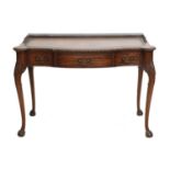 A Late 19th/Early 20th Century Carved Mahogany Writing Table, by Waring & Gillow Ltd, the three-