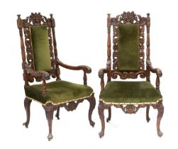 A Pair of 19th Century Carved Walnut Open Armchairs, recovered in green velvet, with padded back