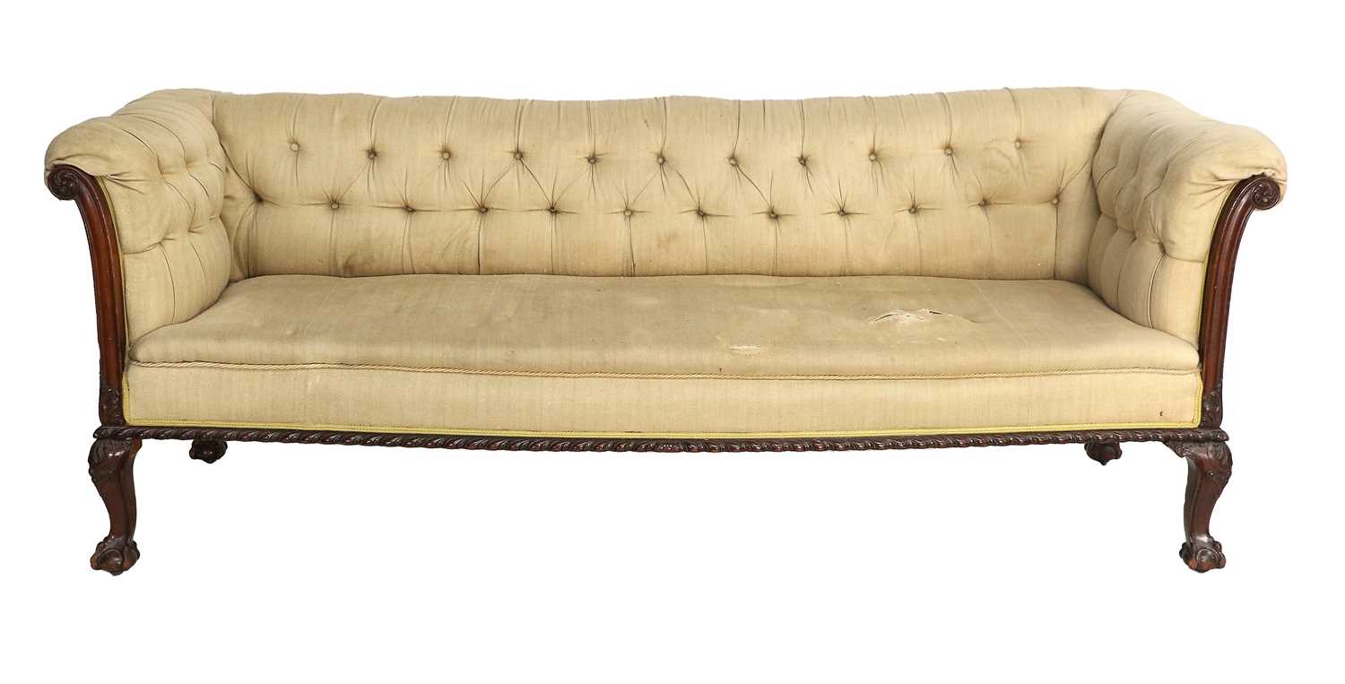 A Victorian Carved Mahogany Three-Seater Chippendale-Style Sofa, late 19th century, covered in