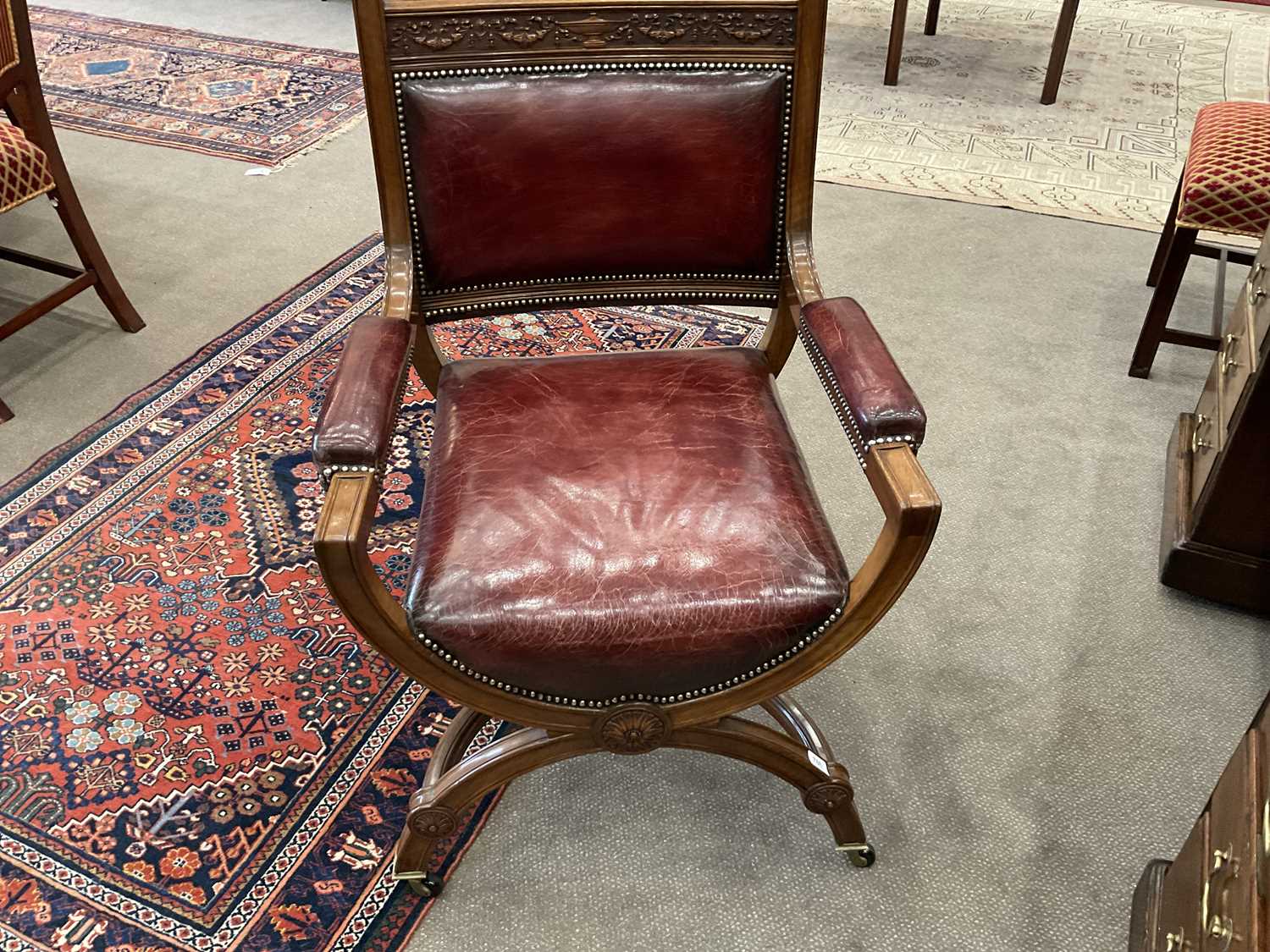 A Victorian Walnut X-Form Chair, late 19th century, recovered in red close-nailed leather, the - Image 2 of 5