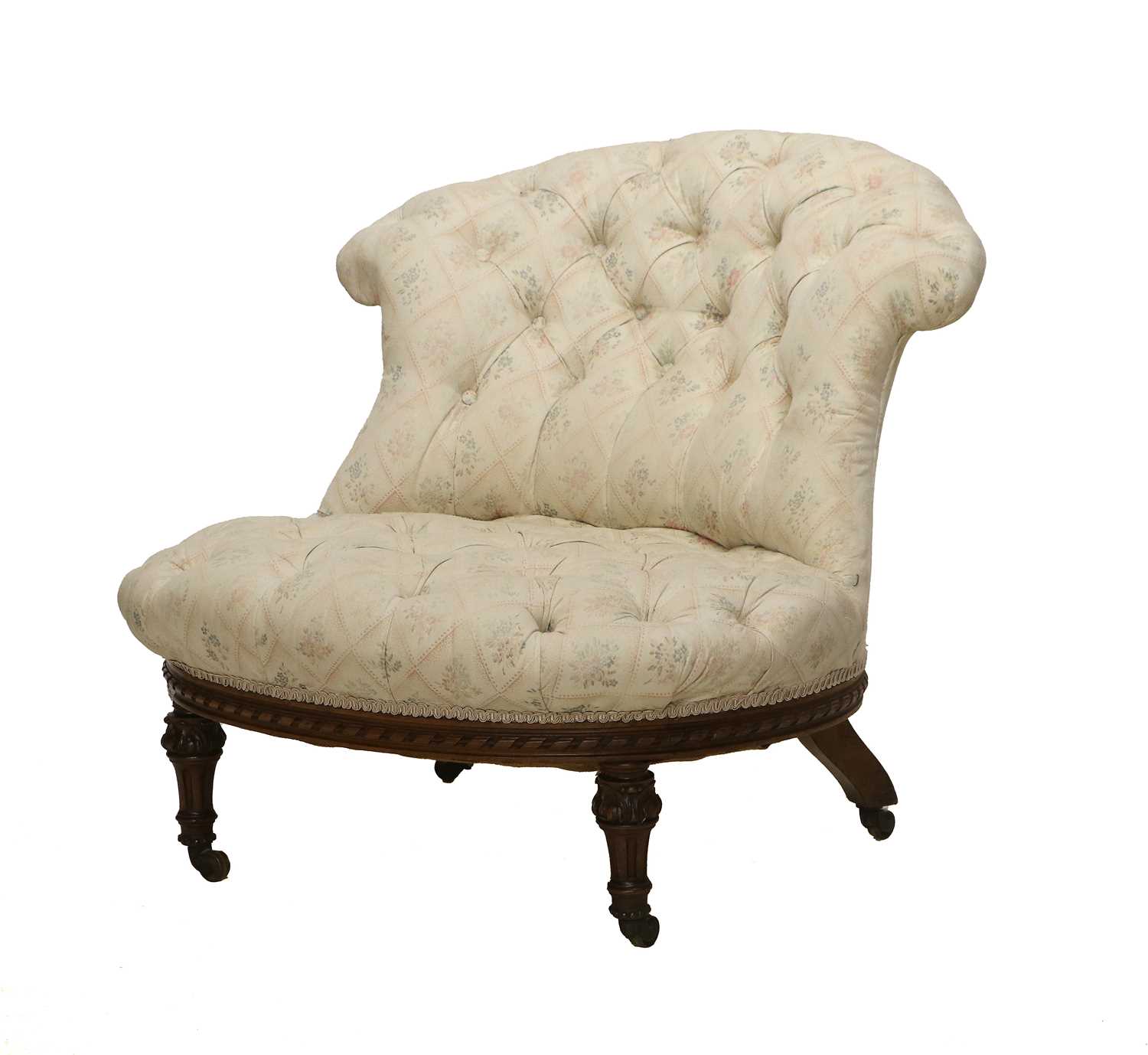 Holland & Sons: A Victorian Carved Walnut Nursing Chair, late 19th century, recovered in cream,