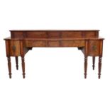 A Regency Mahogany and Ebony-Strung Bowfront Sideboard, in the manner of Gillows, early 19th