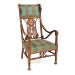 A Late 19th Century Walnut, Satinwood-Banded, Ebony and Boxwood-Strung Open Armchair, recovered in