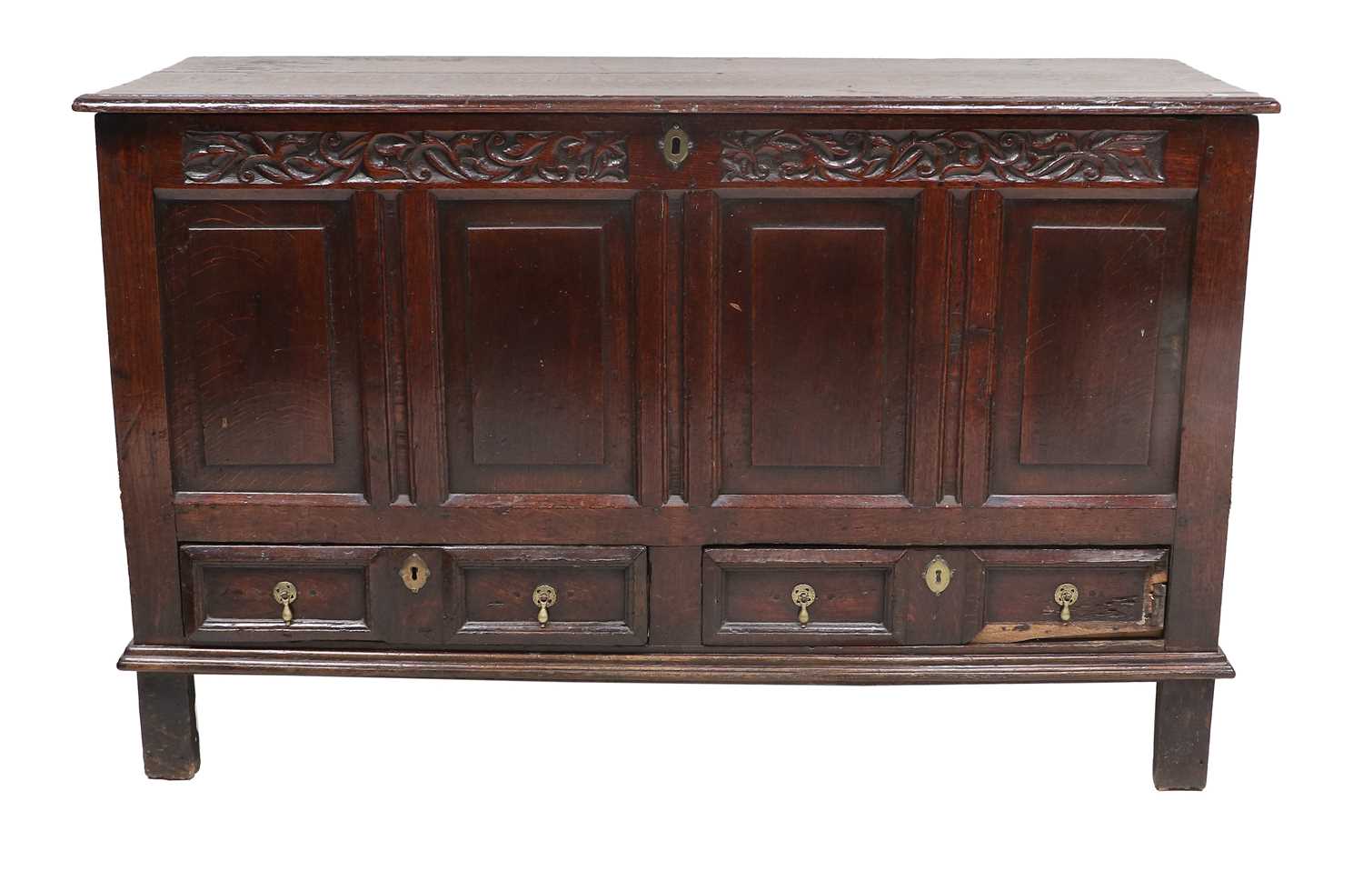 An Early 18th Century Joined Oak Chest, the moulded hinged lid enclosing a vacant interior above a