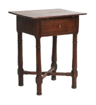 A George III Oak Side Table, 3rd quarter 18th century, the boarded top above a single frieze drawer,