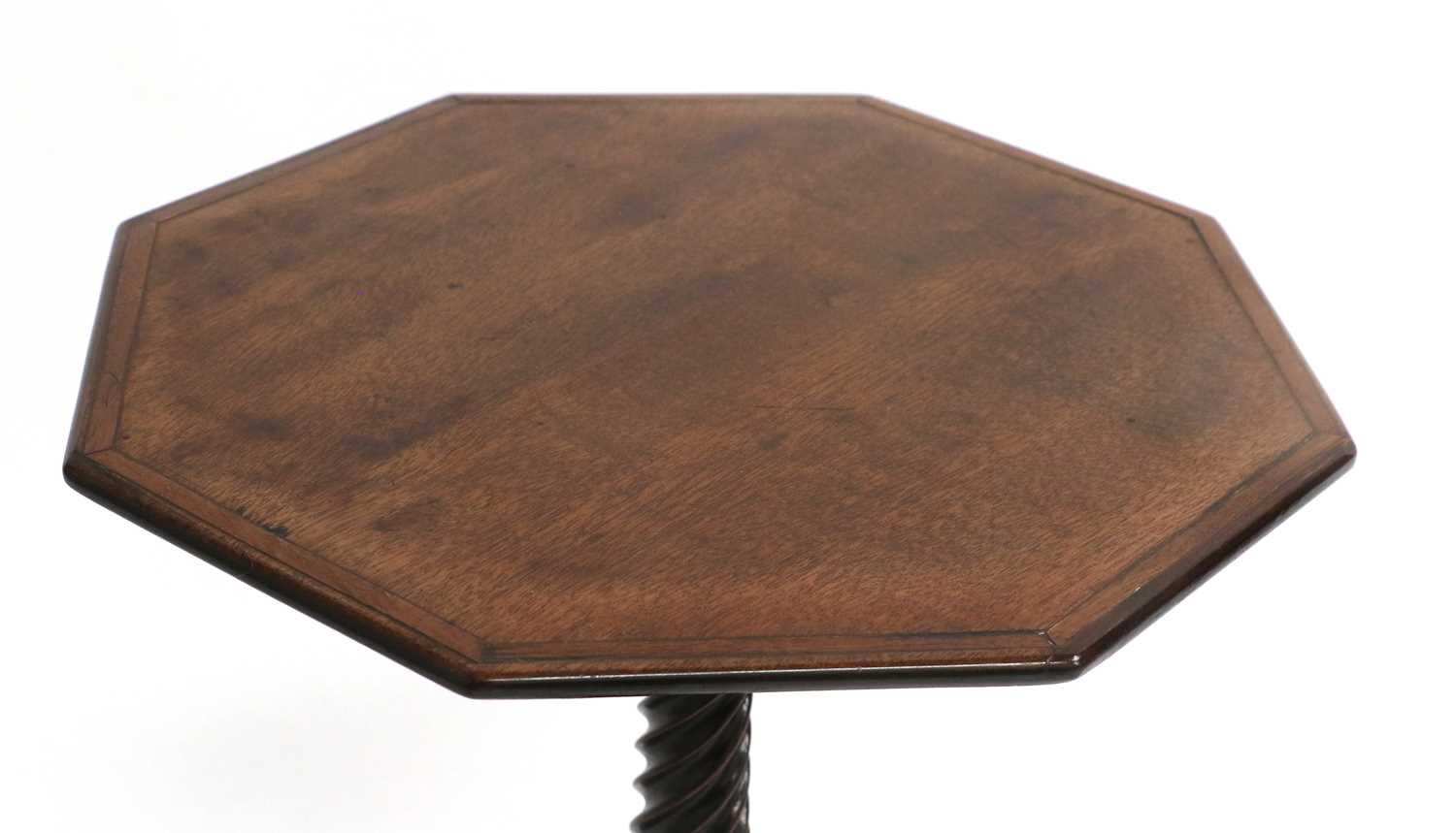 A George III Mahogany Octagonal Wine Table, late 18th century, the crossbanded top on a spiral - Image 3 of 3