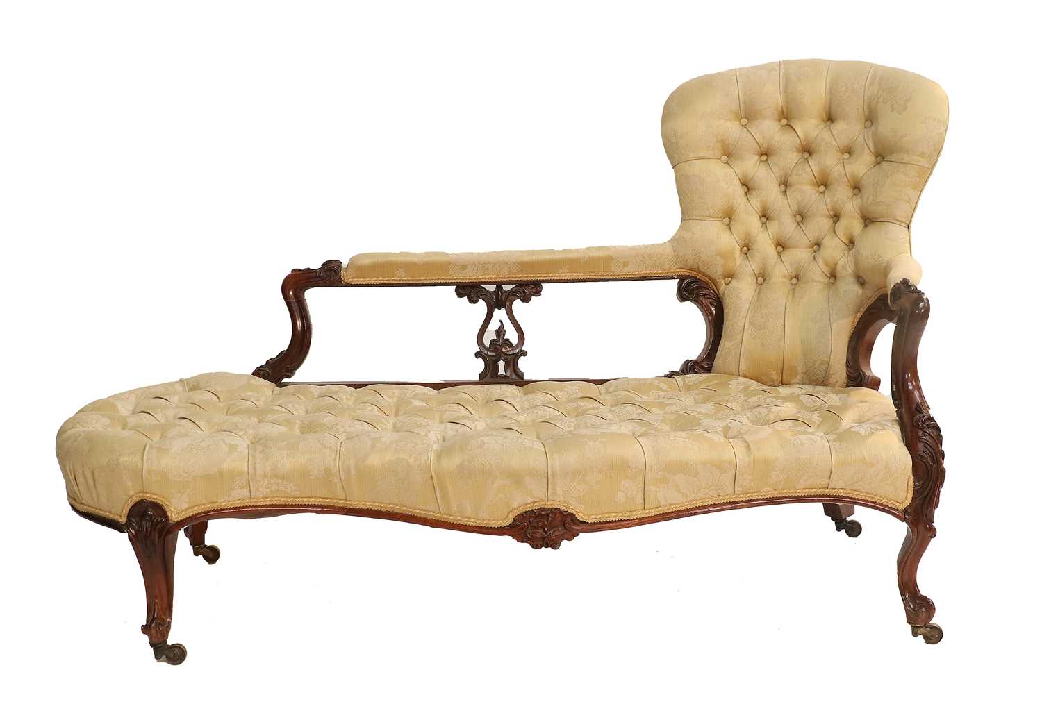 A Victorian Carved Rosewood Framed Sofa, circa 1870, recovered in yellow and cream floral buttoned