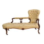 A Victorian Carved Rosewood Framed Sofa, circa 1870, recovered in yellow and cream floral buttoned