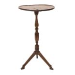 An Early 19th Century Solid Yewwood Tripod Table, the top of dished circular form, on a baluster