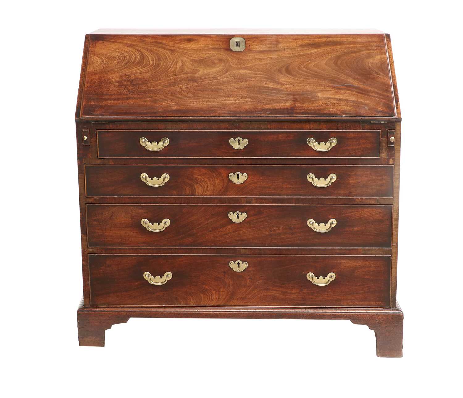 A George III Mahogany Bureau, circa 1760, the fall front with engraved brass escutcheon enclosing