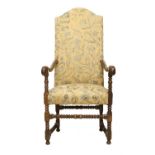 An 18th Century Walnut-Framed Open Armchair, recovered in green and yellow crewel-style fabric, with