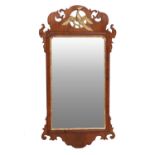 A George III Mahogany and Parcel-Gilt Wall Mirror, circa 1770, the later plain mirror plate within a