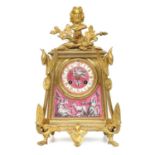 A Gilt Metal and Porcelain Mounted Striking Mantel Clock, circa 1890, case surmounted with a bust of