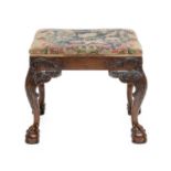 A George III Carved Mahogany Dressing Stool, late 18th century, covered in floral needlework, with