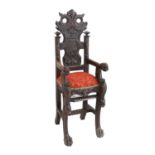 A Victorian Carved Oak Child's High-Chair, possibly Scottish, in 17th century style, the carved