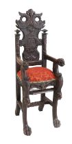 A Victorian Carved Oak Child's High-Chair, possibly Scottish, in 17th century style, the carved