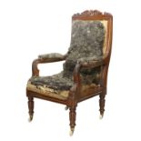 A Victorian Carved Mahogany Open Armchair, 3rd quarter 19th century, in need of recovering, with