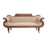A Regency Carved Mahogany Scroll-End Sofa, early 19th century, covered in close-nailed floral
