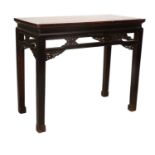 A Late 19th/Early 20th Century Chinese Hardwood Altar Table, the moulded top above humpback