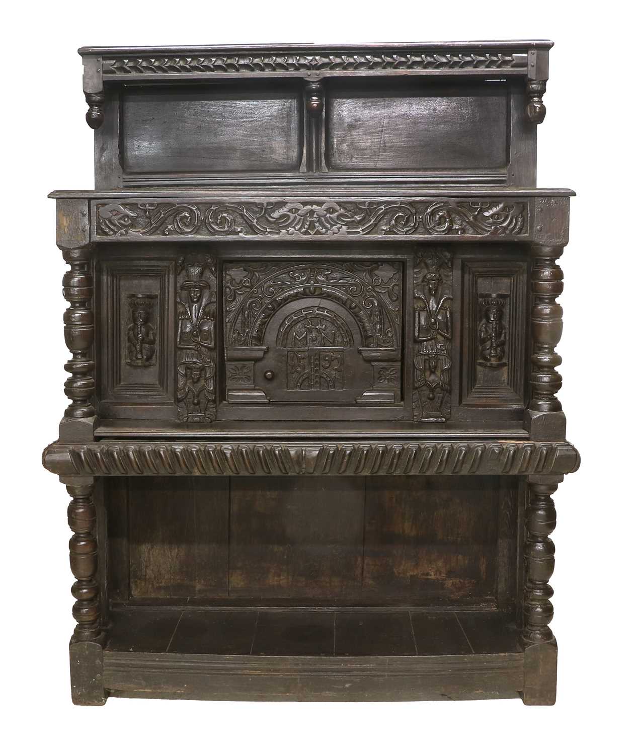 A Late 16th Century Carved Oak Livery Cupboard, initialled MHN and dated 1597, the superstructure