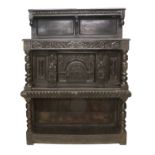 A Late 16th Century Carved Oak Livery Cupboard, initialled MHN and dated 1597, the superstructure