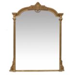 A Victorian Gilt and Gesso Overmantel Mirror, circa 1870, the plain mirror plate between column