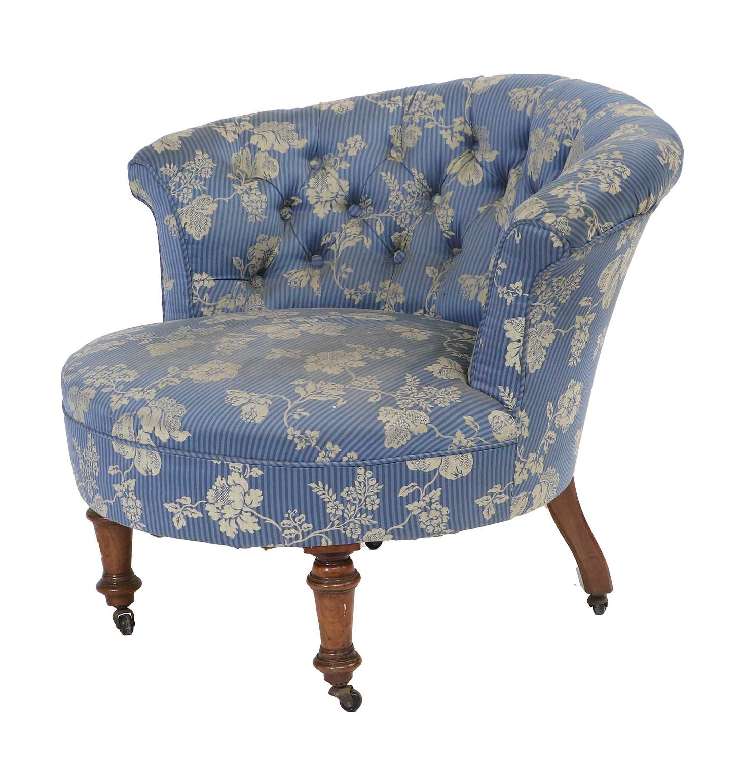 A Victorian Walnut Tub-Shape Nursing Chair, circa 1870, recovered in blue and gold floral buttoned