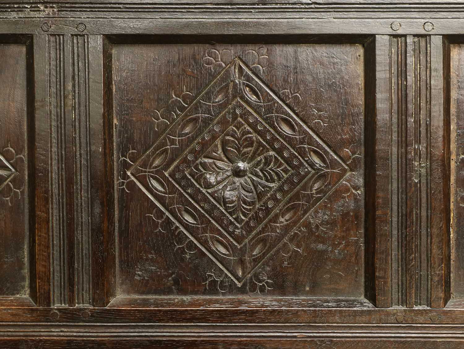 A Carved Oak Settle, the associated back support with nine panels carved with lozenges and scrolls - Image 3 of 3