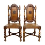 A Pair of Carved Oak Hall Chairs, by Gillows of Lancaster, mid 19th century, the carved top rails