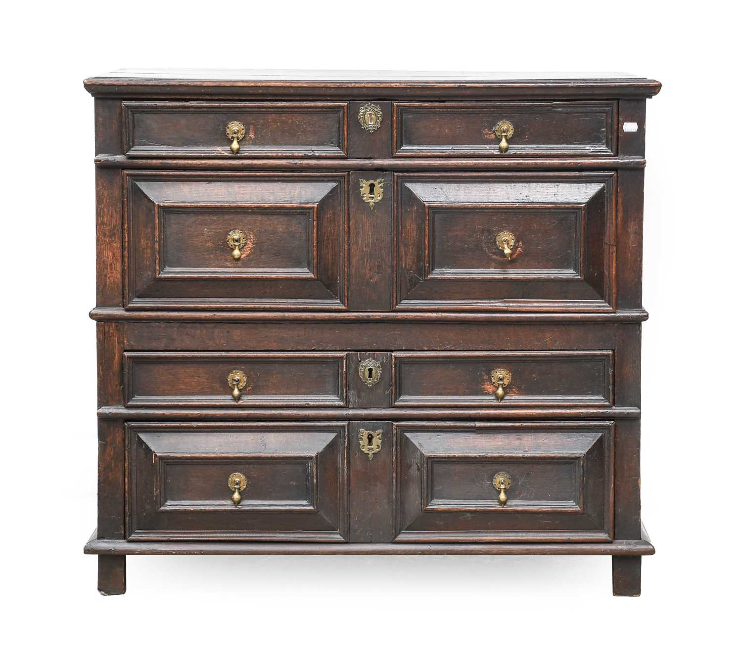 An Oak Geometric-Moulded Chest of Drawers, circa 1700, the moulded top above four two-as-one moulded