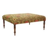 A Victorian-Style Oversized Footstool, recovered in modern red, green and gold fabric, on mahogany