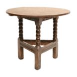 A Circular Oak Cricket Table, late 17th/early 18th century, of plank-top construction with carved