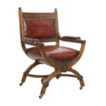 A Victorian Walnut X-Form Chair, late 19th century, recovered in red close-nailed leather, the