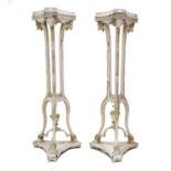 A Pair of Late 19th/Early 20th Century Adam Style Cream Painted and Parcel Gilt Torcheres, the