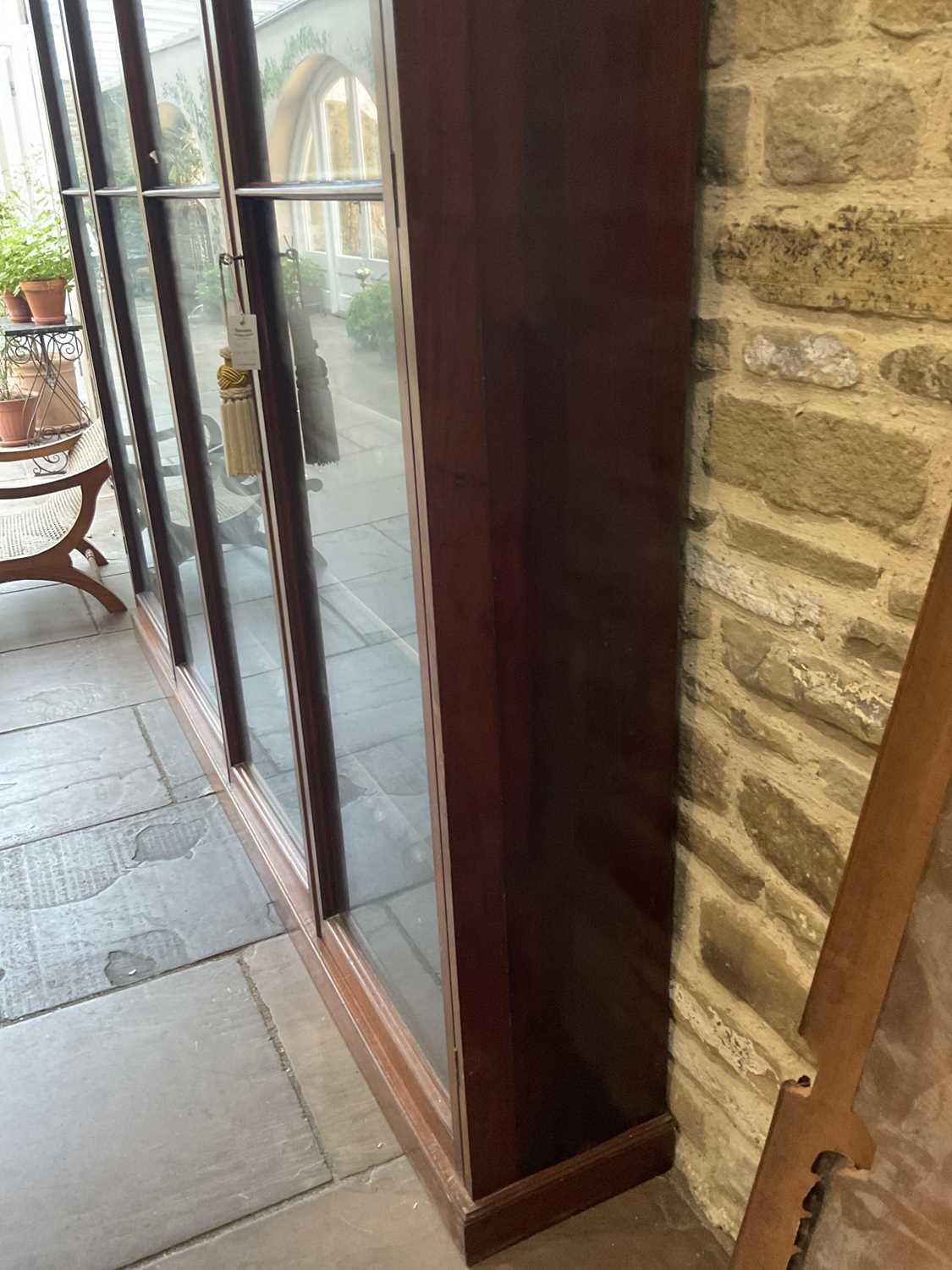 A Victorian Mahogany Bookcase, the moulded cornice above four conforming glazed doors enclosing - Image 7 of 10