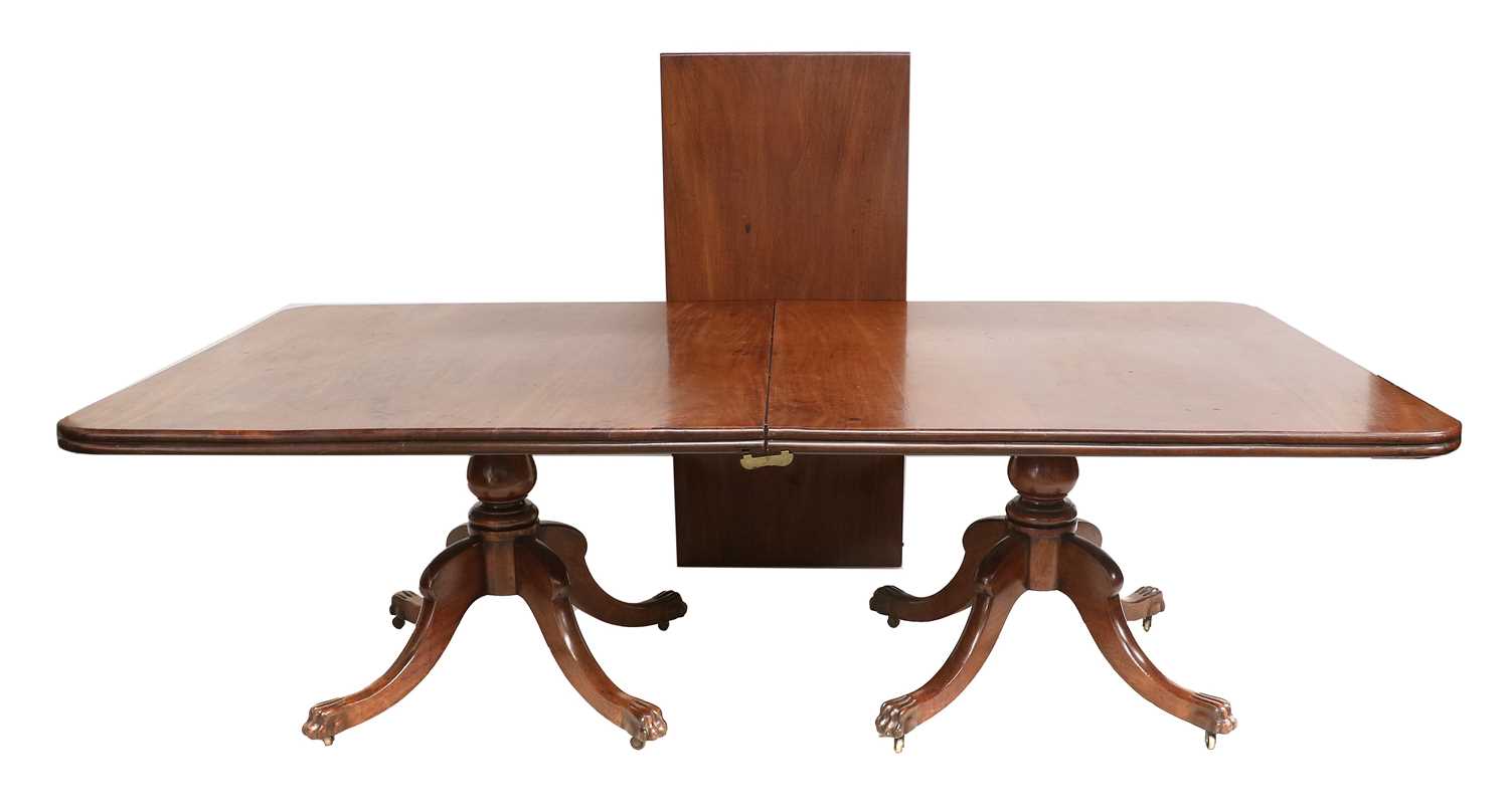 An Irish Regency Mahogany Twin-Pedestal Dining Table, early 19th century, with one additional