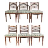 A Set of Six Mahogany Dining Chairs, early 19th century, recovered in worn green silk damask, the