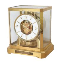 A Brass Atmos Clock, signed Jaeger LeCoultre, 20th Century, case with glass panels, front of the